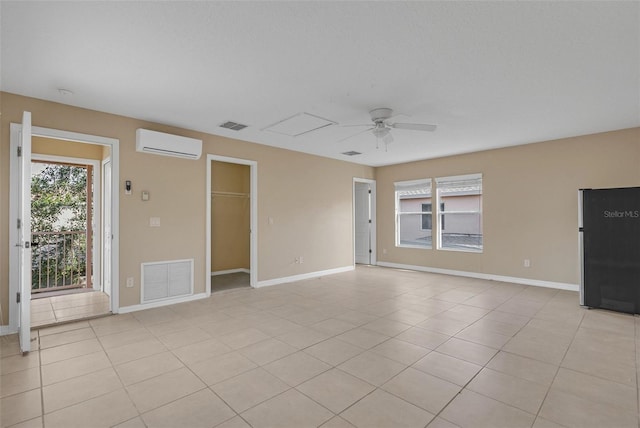 7184 Maleberry Run, Winter Garden, FL 34787 - empty room with an AC wall unit, ceiling fan, healthy amount of natural light, and light tile patterned flooring