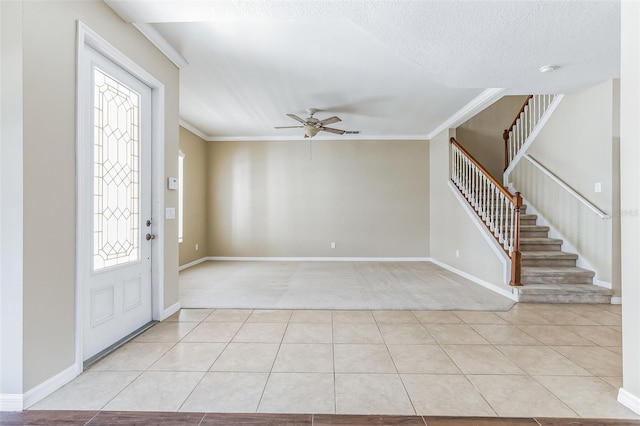 7184 Maleberry Run, Winter Garden, FL 34787 - foyer with ceiling fan, stairs, light tile patterned floors, light colored carpet, and ornamental molding
