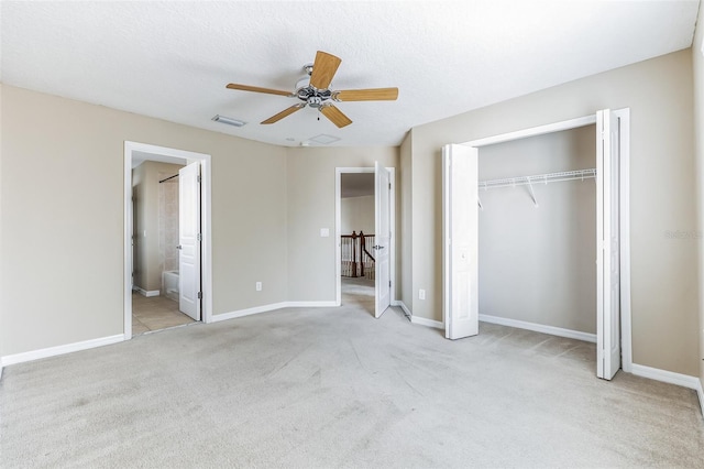 7184 Maleberry Run, Winter Garden, FL 34787 - unfurnished bedroom with carpet, a closet, a ceiling fan, and connected bathroom