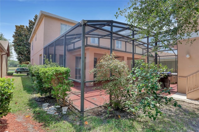 7184 Maleberry Run, Winter Garden, FL 34787 - view of side of home featuring stucco siding and glass enclosure