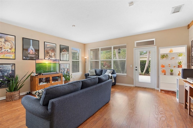 12868 Holdenbury Ln, Windermere, FL 34786 - living area with hardwood / wood-style flooring and baseboards