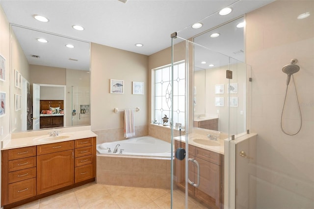 12868 Holdenbury Ln, Windermere, FL 34786 - full bathroom featuring a shower stall, tile patterned flooring, a bath, vanity, and recessed lighting