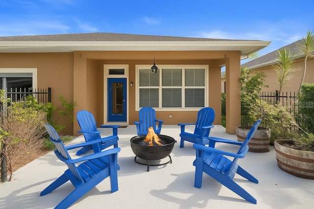 12868 Holdenbury Ln, Windermere, FL 34786 - view of patio / terrace featuring a fire pit