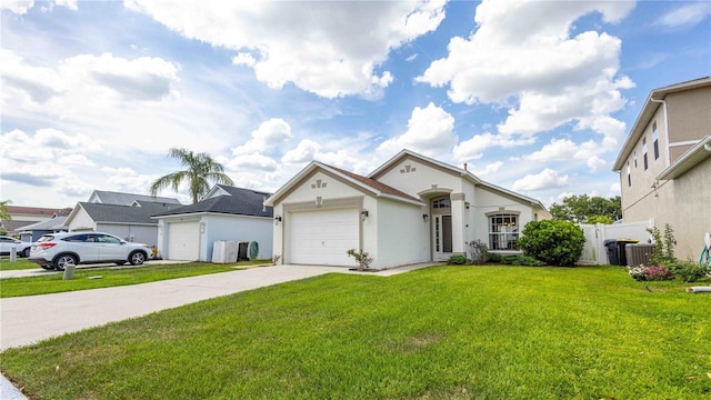 131 Sonja Cir, Davenport, FL 33897 - view of front of house with a garage, driveway, and stucco siding