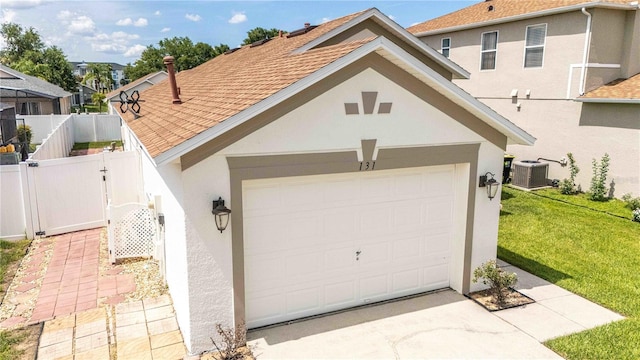 131 Sonja Cir, Davenport, FL 33897 - garage with driveway and a gate