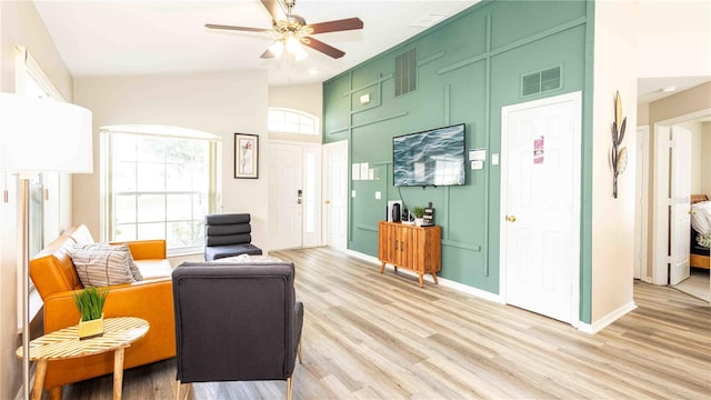 131 Sonja Cir, Davenport, FL 33897 - living area with a ceiling fan, light wood-style flooring, and a towering ceiling