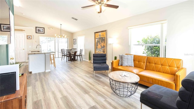 131 Sonja Cir, Davenport, FL 33897 - living area with vaulted ceiling, a chandelier, light wood-type flooring, and ceiling fan