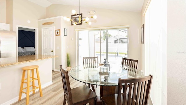 131 Sonja Cir, Davenport, FL 33897 - dining space featuring light wood-style floors, a chandelier, and lofted ceiling