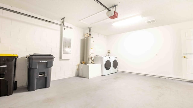 131 Sonja Cir, Davenport, FL 33897 - garage with washing machine and clothes dryer, gas water heater, a garage door opener, electric panel, and concrete block wall