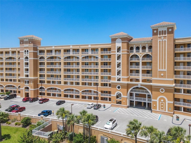 60 Surfview Dr Unit 308, Palm Coast, FL 32137 - view of apartment building / complex featuring uncovered parking