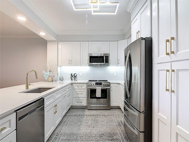 60 Surfview Dr Unit 308, Palm Coast, FL 32137 - kitchen featuring appliances with stainless steel finishes, white cabinetry, crown molding, light stone countertops, and decorative backsplash