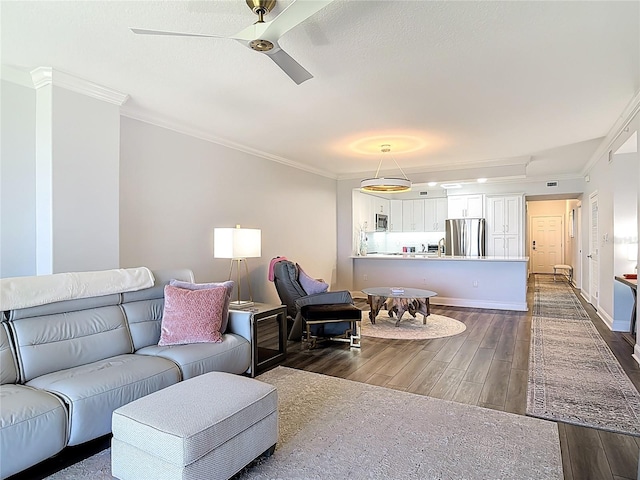 60 Surfview Dr Unit 308, Palm Coast, FL 32137 - living room with ornamental molding, dark wood finished floors, and ceiling fan