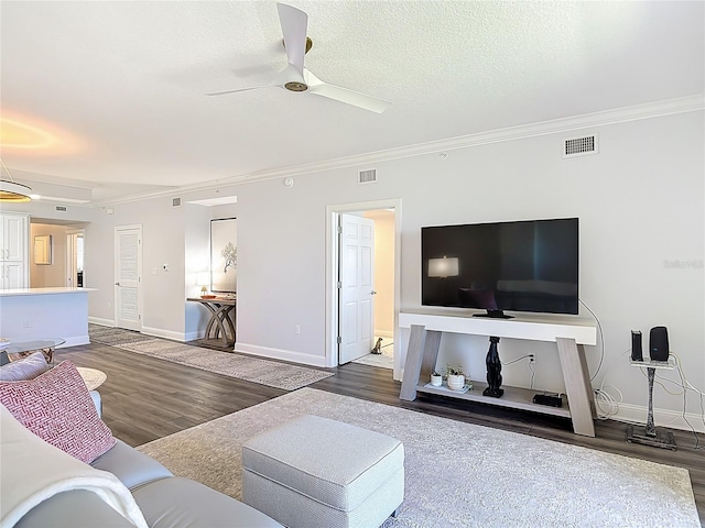 60 Surfview Dr Unit 308, Palm Coast, FL 32137 - living area with crown molding, wood finished floors, and a ceiling fan
