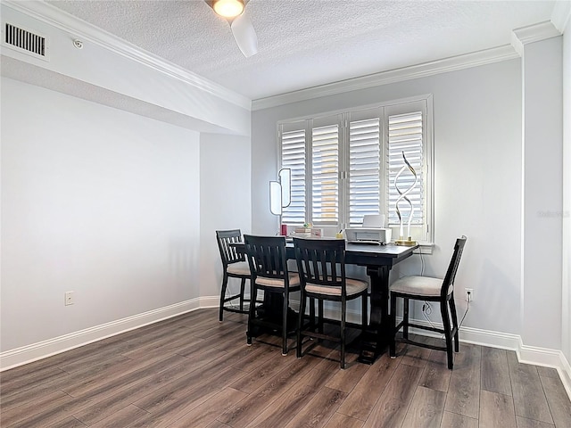 60 Surfview Dr Unit 308, Palm Coast, FL 32137 - dining area featuring wood finished floors, ornamental molding, and a textured ceiling