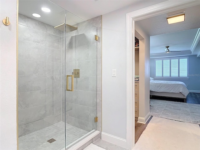 60 Surfview Dr Unit 308, Palm Coast, FL 32137 - bathroom with a stall shower, connected bathroom, ceiling fan, and recessed lighting