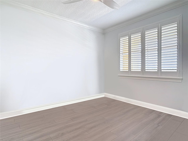 60 Surfview Dr Unit 308, Palm Coast, FL 32137 - spare room with a textured ceiling, wood finished floors, crown molding, and a ceiling fan