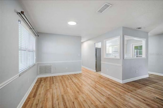 2813 21st Ave W, Bradenton, FL 34205 - empty room featuring healthy amount of natural light and light wood-style flooring