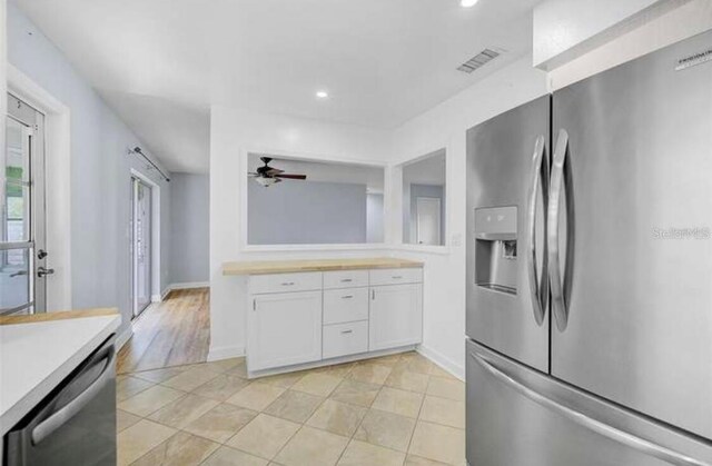 2813 21st Ave W, Bradenton, FL 34205 - kitchen with stainless steel appliances, white cabinetry, light countertops, ceiling fan, and recessed lighting