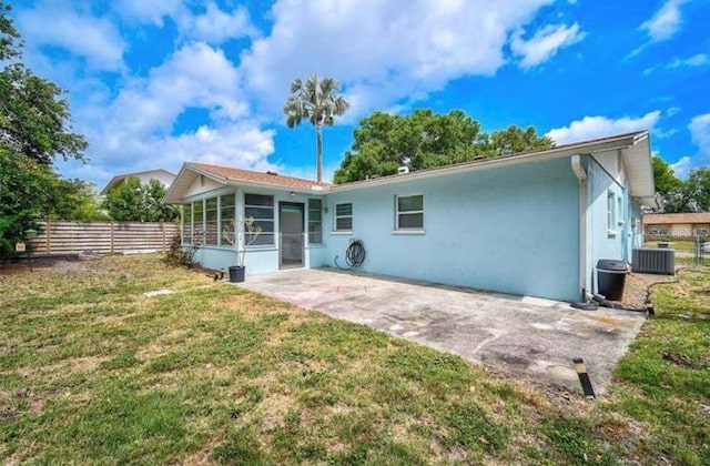 2813 21st Ave W, Bradenton, FL 34205 - rear view of property with a sunroom, stucco siding, and a patio area