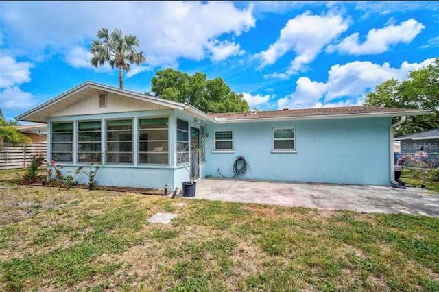 2813 21st Ave W, Bradenton, FL 34205 - rear view of property with a patio area, a sunroom, and stucco siding