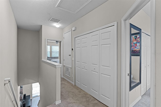 14242 Desert Haven St Unit Ge, Windermere, FL 34786 - corridor featuring carpet flooring, an upstairs landing, and a textured ceiling