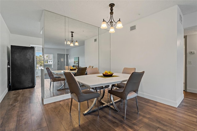 2257 World Parkway Blvd W Unit 61, Clearwater, FL 33763 - dining area with a chandelier, hardwood / wood-style flooring, and a textured ceiling