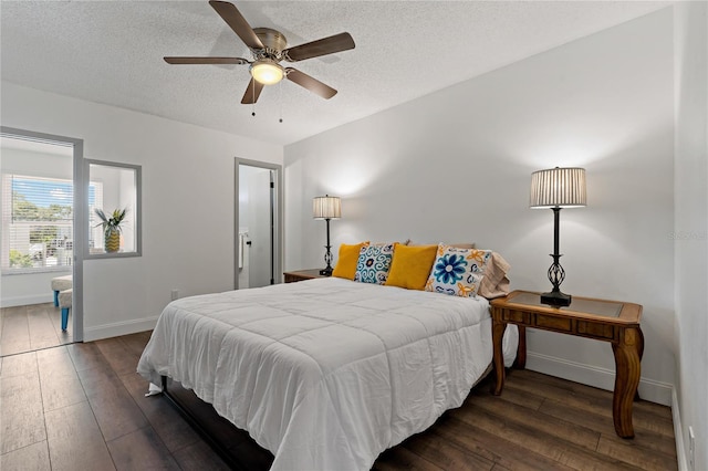 2257 World Parkway Blvd W Unit 61, Clearwater, FL 33763 - bedroom featuring hardwood / wood-style floors, a textured ceiling, and a ceiling fan