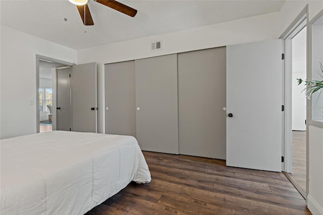 2257 World Parkway Blvd W Unit 61, Clearwater, FL 33763 - bedroom with hardwood / wood-style floors, a closet, and a ceiling fan