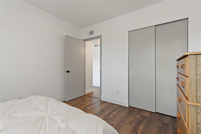 2257 World Parkway Blvd W Unit 61, Clearwater, FL 33763 - bedroom with wood-type flooring and a closet