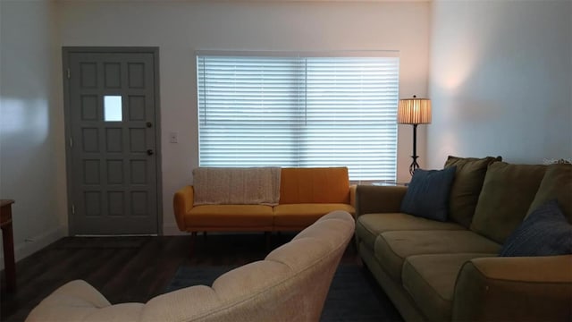 2257 World Parkway Blvd W Unit 61, Clearwater, FL 33763 - living room featuring baseboards and wood finished floors