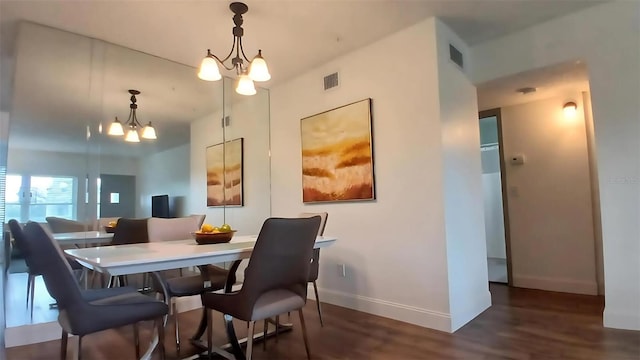 2257 World Parkway Blvd W Unit 61, Clearwater, FL 33763 - dining room with a chandelier and wood finished floors