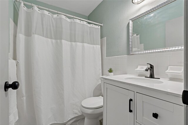 2257 World Parkway Blvd W Unit 61, Clearwater, FL 33763 - bathroom featuring vanity, tile walls, and a shower with shower curtain