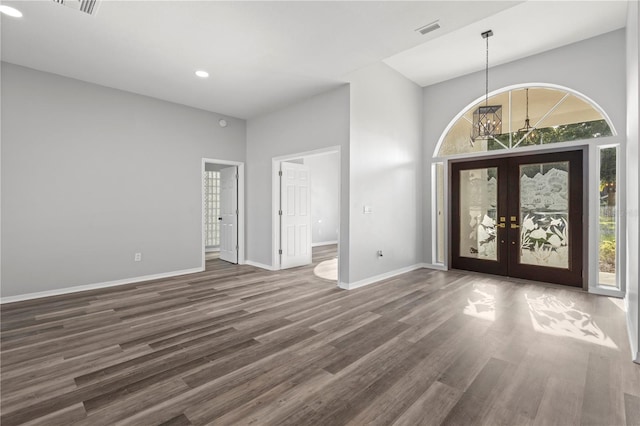 17032 Winners Cir, Odessa, FL 33556 - entryway featuring french doors, dark wood-style floors, a towering ceiling, and recessed lighting