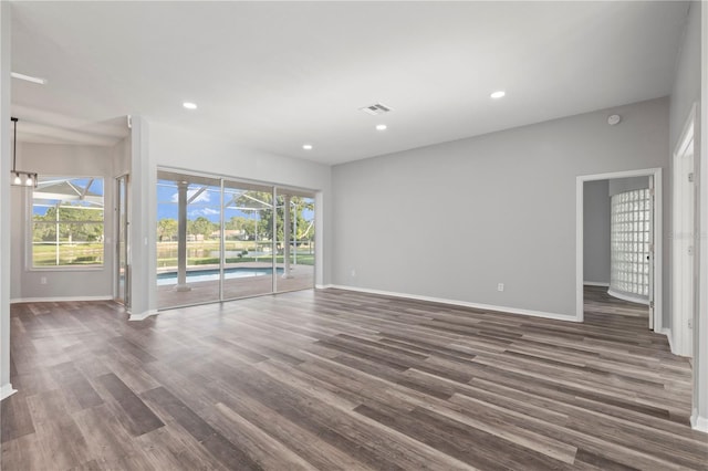 17032 Winners Cir, Odessa, FL 33556 - empty room featuring dark wood-style flooring and recessed lighting