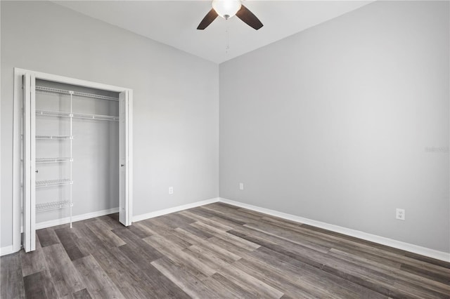 17032 Winners Cir, Odessa, FL 33556 - unfurnished bedroom featuring dark wood-type flooring, a ceiling fan, and a closet