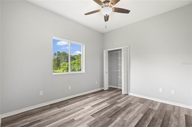 17032 Winners Cir, Odessa, FL 33556 - unfurnished bedroom featuring wood finished floors, a closet, and ceiling fan