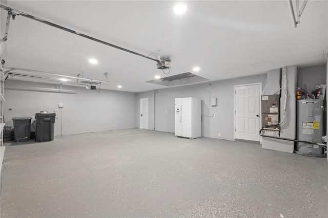 17032 Winners Cir, Odessa, FL 33556 - garage with white refrigerator with ice dispenser, electric water heater, recessed lighting, and a garage door opener