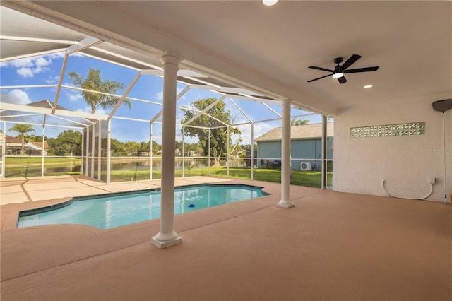 17032 Winners Cir, Odessa, FL 33556 - outdoor pool with a patio area, a water view, a ceiling fan, and a lanai