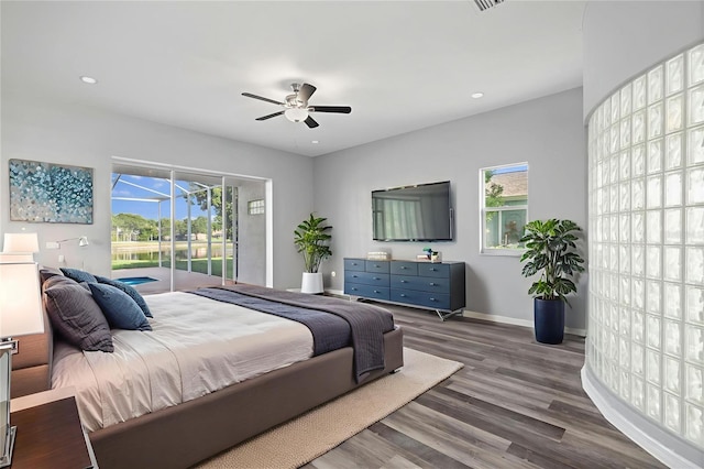 17032 Winners Cir, Odessa, FL 33556 - bedroom featuring access to exterior, multiple windows, wood finished floors, recessed lighting, and a ceiling fan