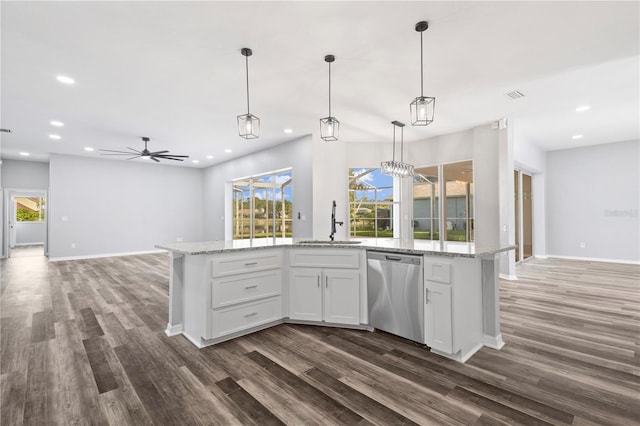 17032 Winners Cir, Odessa, FL 33556 - kitchen with stainless steel dishwasher, open floor plan, dark wood-style floors, and recessed lighting