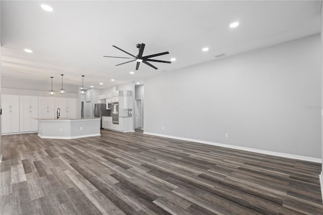 17032 Winners Cir, Odessa, FL 33556 - unfurnished living room featuring ceiling fan, dark wood-style floors, and recessed lighting