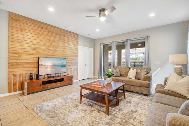 8901 Rhodes St, Kissimmee, FL 34747 - living area with a ceiling fan, wooden walls, recessed lighting, and tile patterned floors