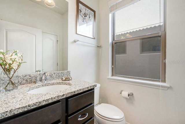 8901 Rhodes St, Kissimmee, FL 34747 - half bathroom featuring vanity and toilet