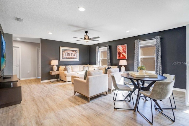 8901 Rhodes St, Kissimmee, FL 34747 - living room featuring ceiling fan, light wood-style flooring, recessed lighting, and a textured ceiling