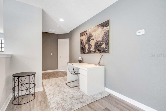 8901 Rhodes St, Kissimmee, FL 34747 - home office featuring light wood-style flooring and baseboards
