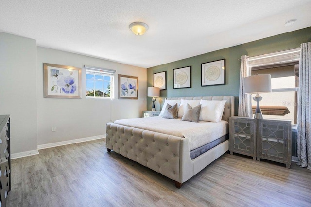 8901 Rhodes St, Kissimmee, FL 34747 - bedroom featuring wood finished floors and baseboards