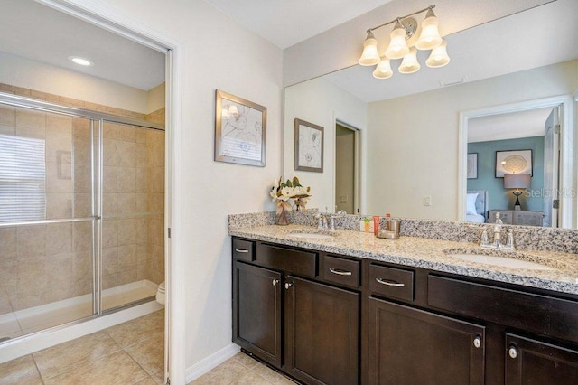8901 Rhodes St, Kissimmee, FL 34747 - bathroom featuring double vanity, a stall shower, tile patterned flooring, a chandelier, and connected bathroom