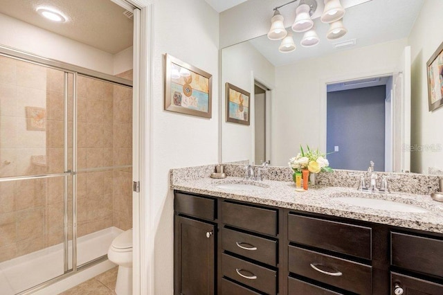 8901 Rhodes St, Kissimmee, FL 34747 - full bath with double vanity, a stall shower, and tile patterned floors
