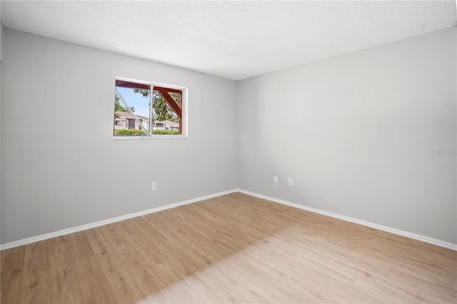 2850 N Powers Dr Unit 74, Orlando, FL 32818 - empty room featuring light wood finished floors and baseboards