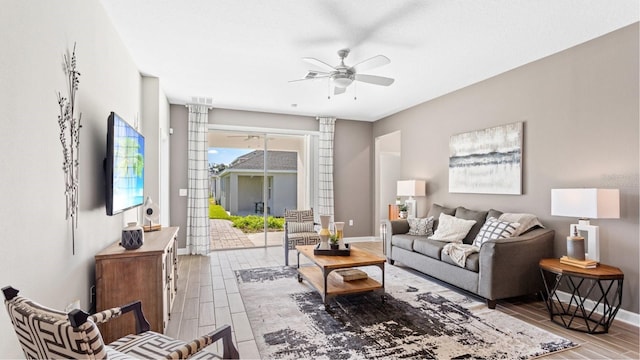 4792 Waltham Forest Dr, Davenport, FL 33837 - living area featuring a ceiling fan, wood finish floors, and decorative columns